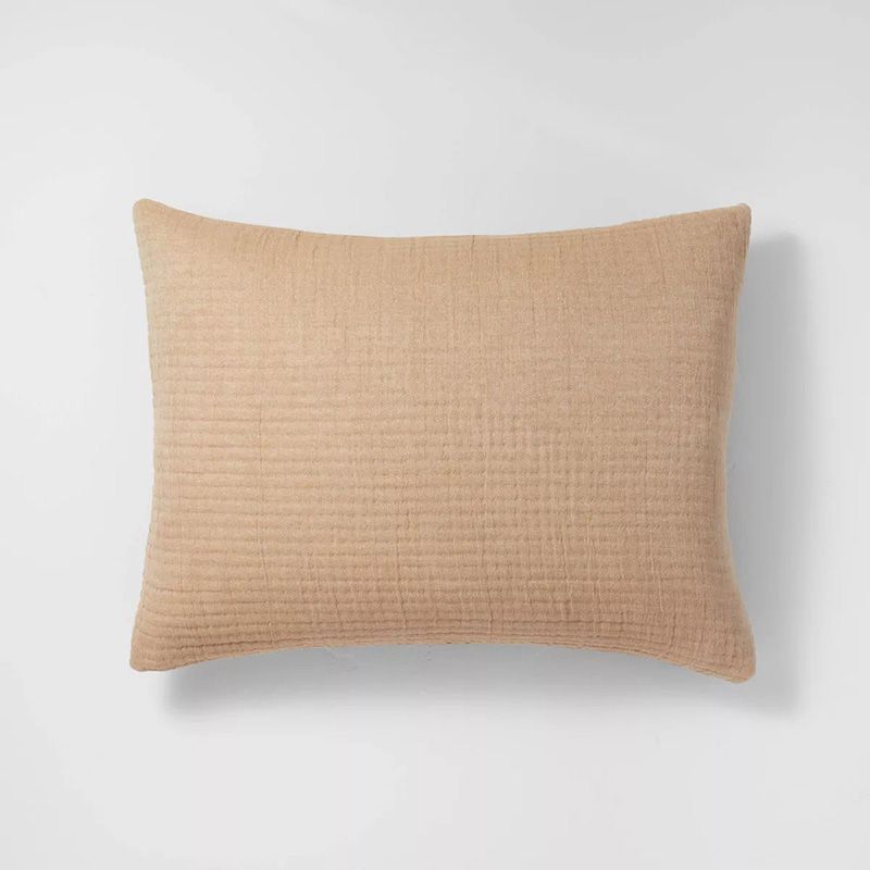 a tan throw pillow